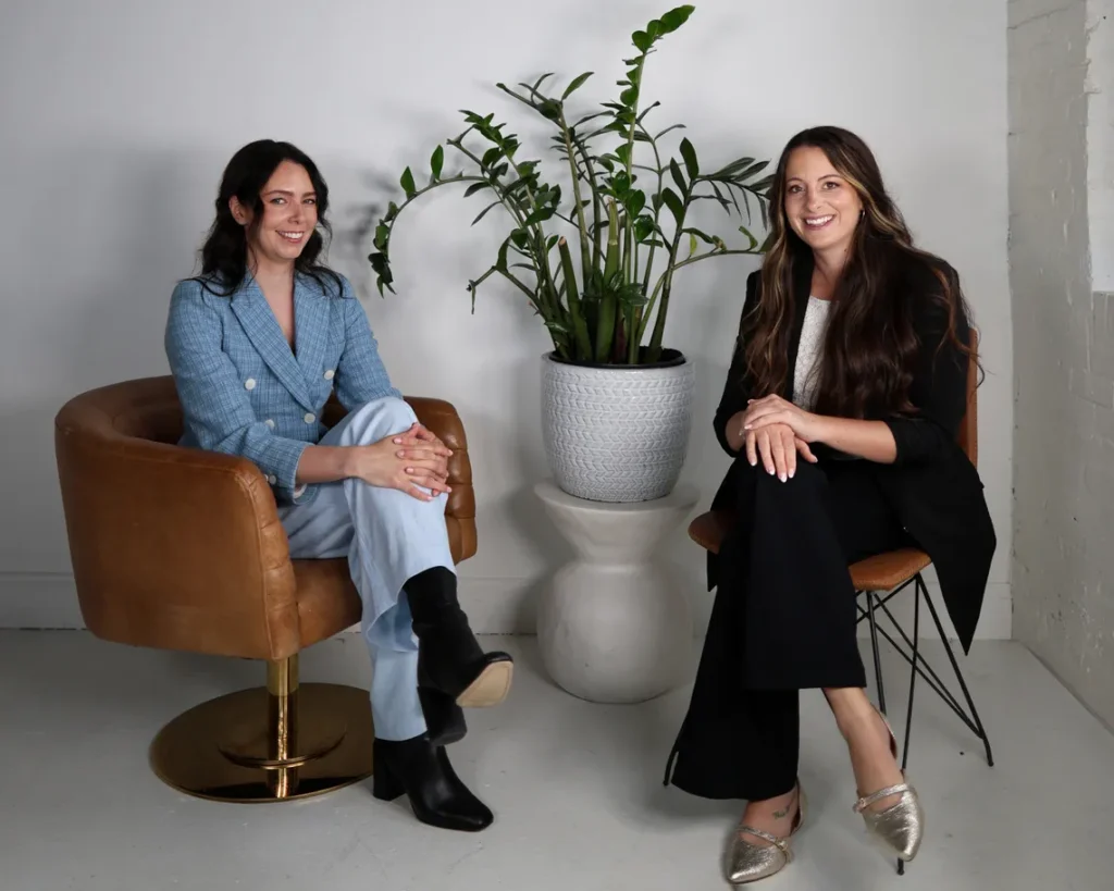 Dr. Amanda Mead and Dr. Ashley Welch of Polaris Psychology, sitting together and smiling.